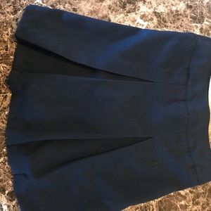 Blue and tan girl school uniform skirts